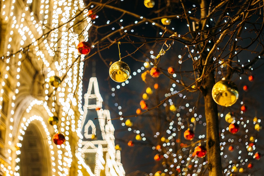holiday lights on trees and buildings