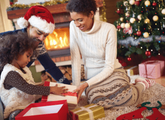 family opening christmas gifts together