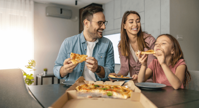 family eating pizza