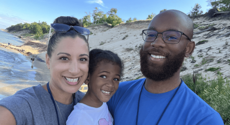 a family photo of Natasha and her family at the beach