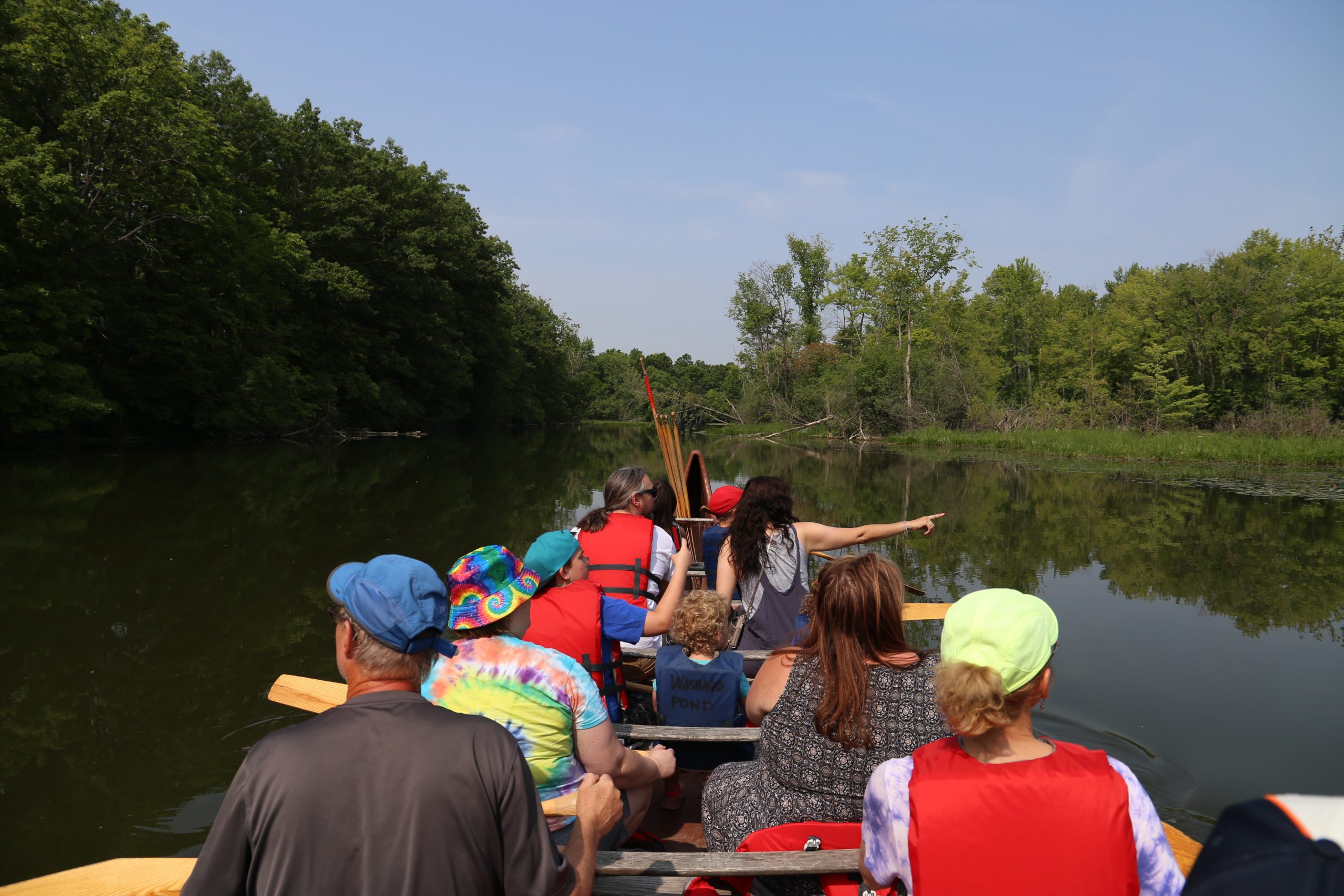 men, women, and a child on canoe in the Huron-Clinton Metroparks