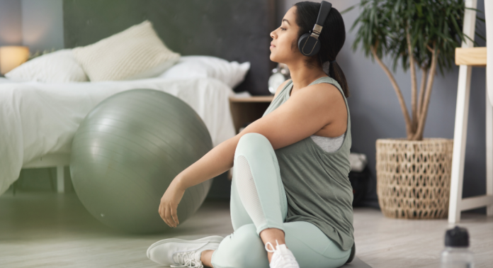 woman stretching before workout at home